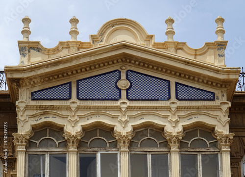 Detail of enclosed balcony. Revival building in the city center of Almeria. Spain.  