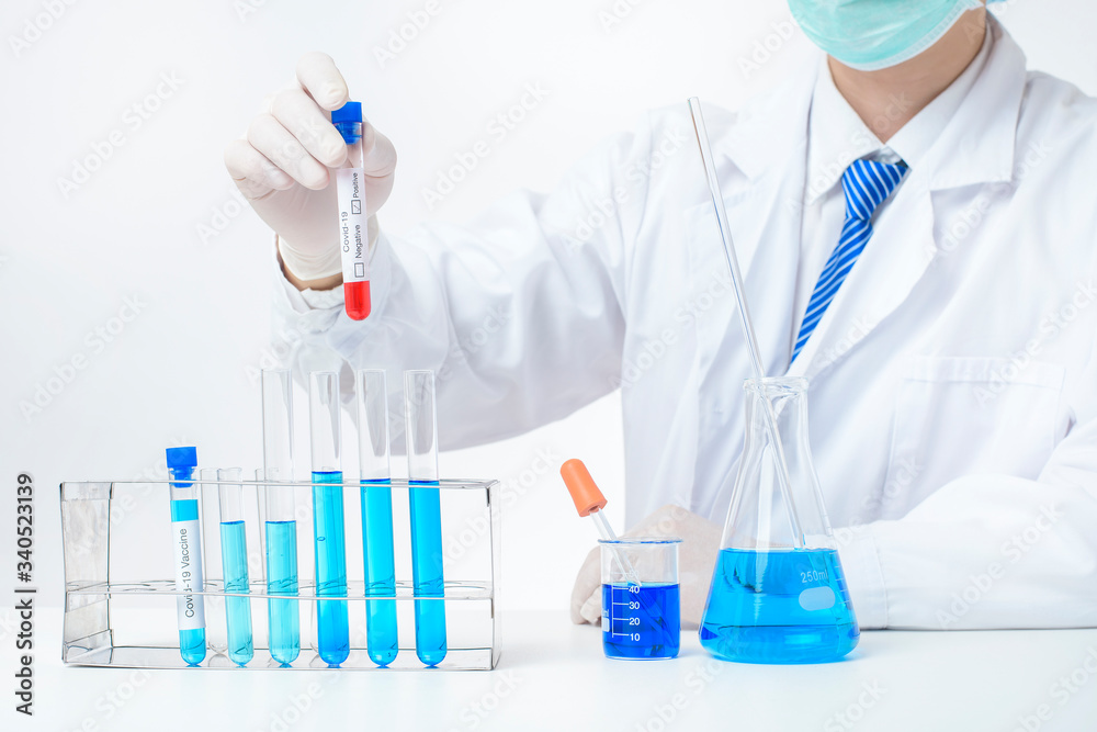 laboratory assistant hand is holding blood test infected Covid-19 laboratory assistant hand is holding blood test infected Covid-19