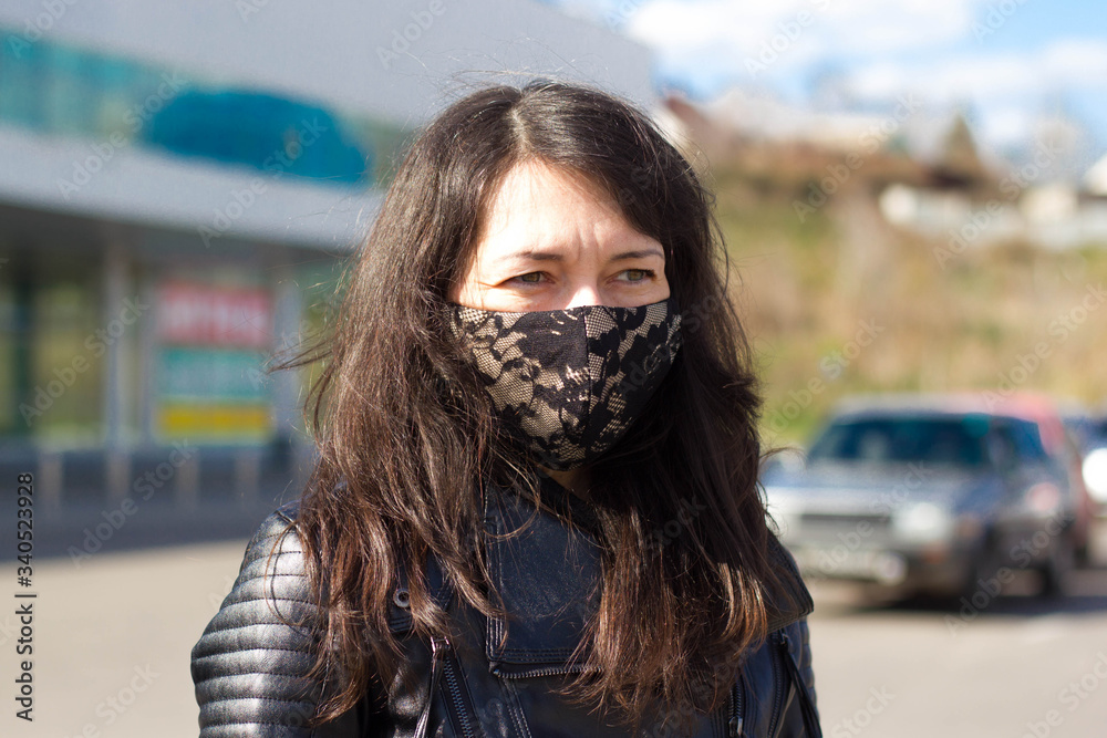 blurred background girl in a stylish protective mask from covid-19 in the city blurred background girl in a stylish protective mask from covid-19 in the city