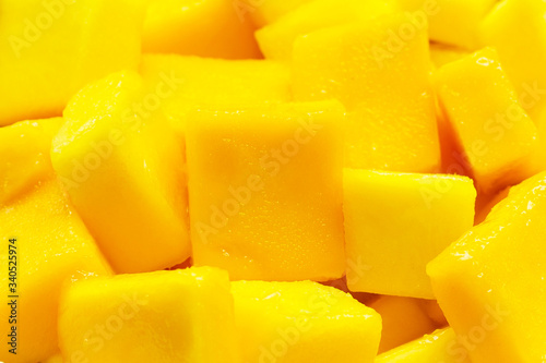 Mango slice cut to cubes background.