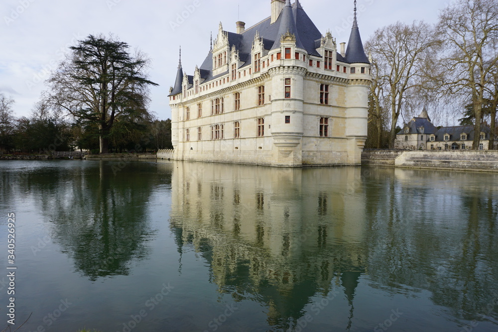 mirror reflection of an old stone castle in the pond in the country mirror reflection of an old stone castle in the pond in the country