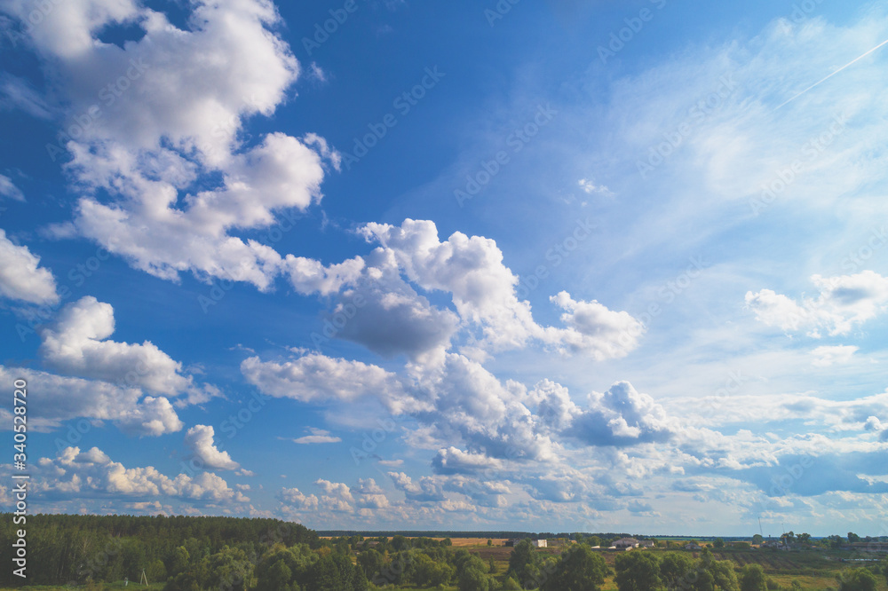 Blue sky with clouds over the countryside. Abstract nature sky background. Aerial view. Sky texture, abstract nature background Blue sky with clouds over the countryside. Abstract nature sky background. Aerial view. Sky texture, abstract nature background