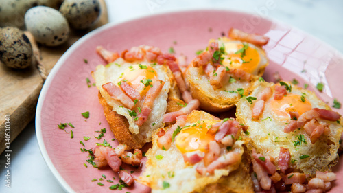 Traditional tapa fried quail eggs with bacon