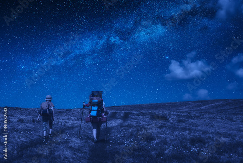 Family hikers have a trekking at night