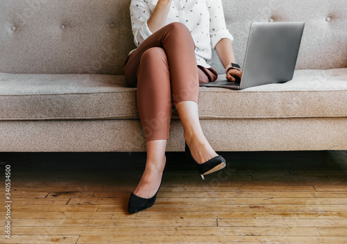 Woman sitting with crossed legs photo