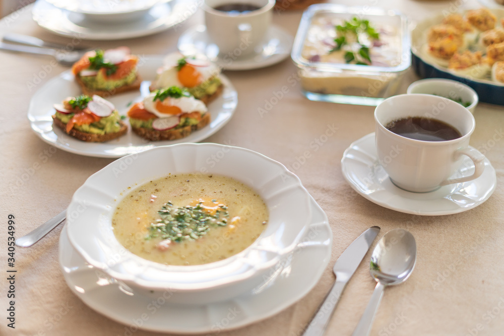 Festive Easter table setting with traditional meals. Easter breakfast in Poland. Christian tradition commemorating the resurrection of Jesus. Festive Easter table setting with traditional meals. Easter breakfast in Poland. Christian tradition commemorating the resurrection of Jesus.