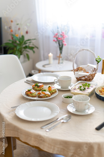 Festive Easter table setting with traditional meals. Easter breakfast in Poland. Christian tradition commemorating the resurrection of Jesus.