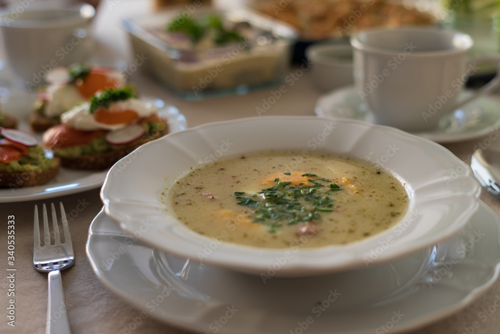 Festive Easter table setting with traditional meals. Easter breakfast in Poland. Christian tradition commemorating the resurrection of Jesus. Festive Easter table setting with traditional meals. Easter breakfast in Poland. Christian tradition commemorating the resurrection of Jesus.