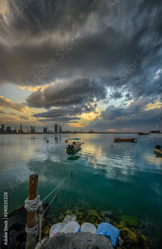 Bahrain Skyline with striking clouds, a view from Al Ghous park, Muharraq