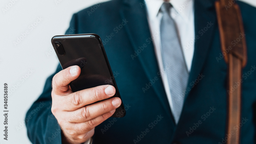 Businessman checking his phone Businessman checking his phone