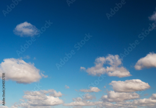 Fototapeta Naklejka Na Ścianę i Meble -  clouds swiftly swim through the blue sky of the day