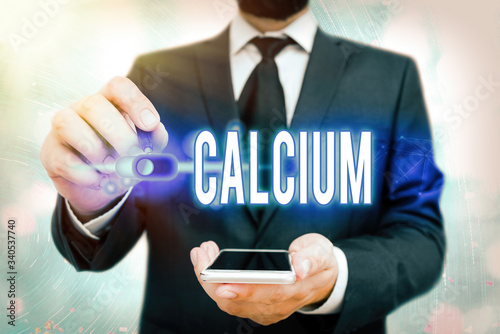 Word writing text Calcium. Business photo showcasing fifth most abundant element in the body Silverwhite metal photo