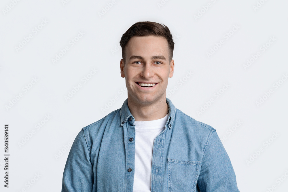Smiling handsome guy isolated on white background Smiling handsome guy isolated on white background