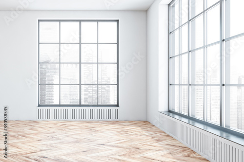 Empty white room interior with windows