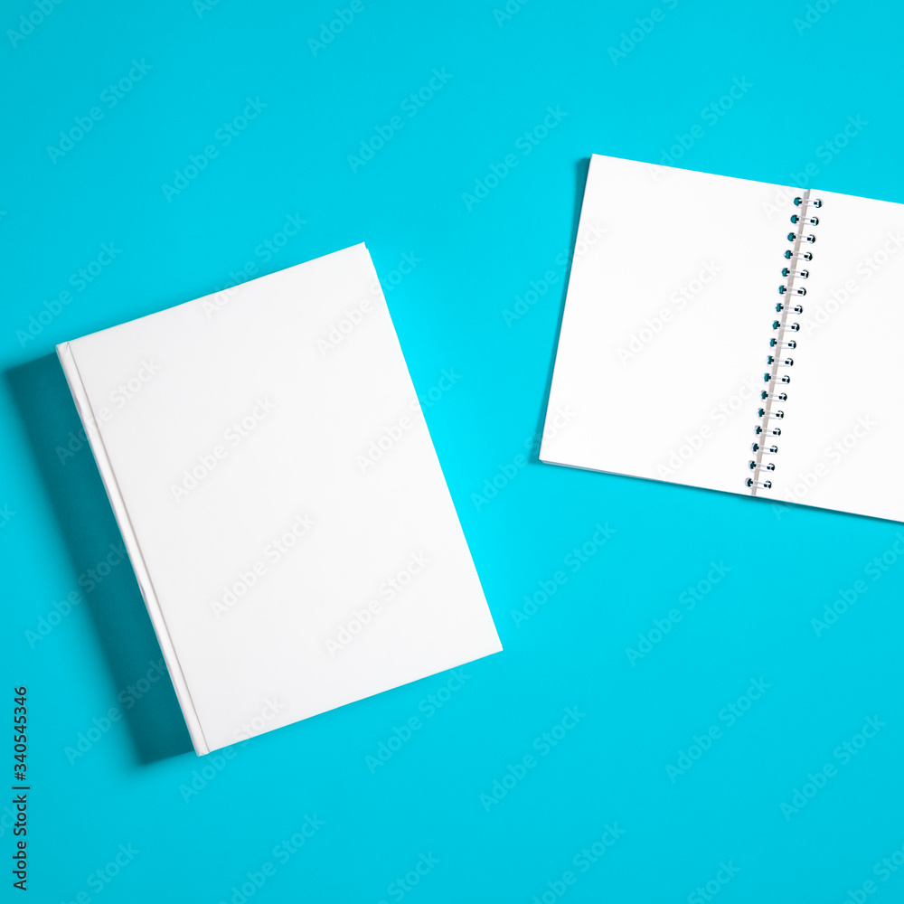 Mockup of closed blank square book at white textured paper Mockup of closed blank square book at white textured paper