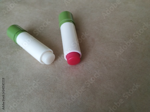 Obraz na plátně colorless and red lip balm. lipstick