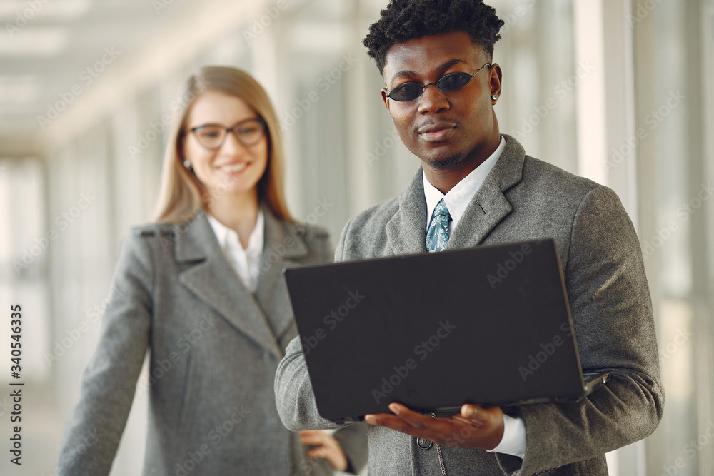 Handsome man in a black suit. Businessman working in a office. Woman with her partner. Handsome man in a black suit. Businessman working in a office. Woman with her partner.