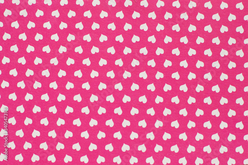 Pink paper texture with white hearts