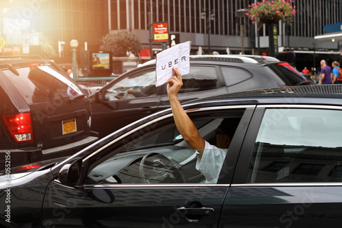 driver uber car in black car in the street of new york 