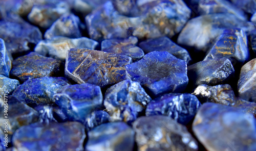 Lapis Is a beautiful natural gemstone on a wooden floor	