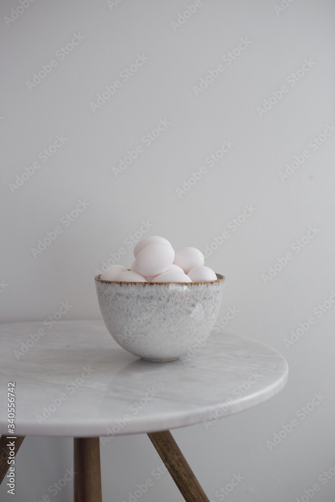 Rustic bowl of raw chicken eggs. Easter minimalism concept Rustic bowl of raw chicken eggs. Easter minimalism concept