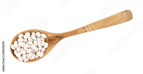 Soy beans on a wooden spoon isolated on a white background