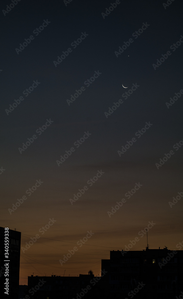 Fototapeta premium Moon and Venus over the city