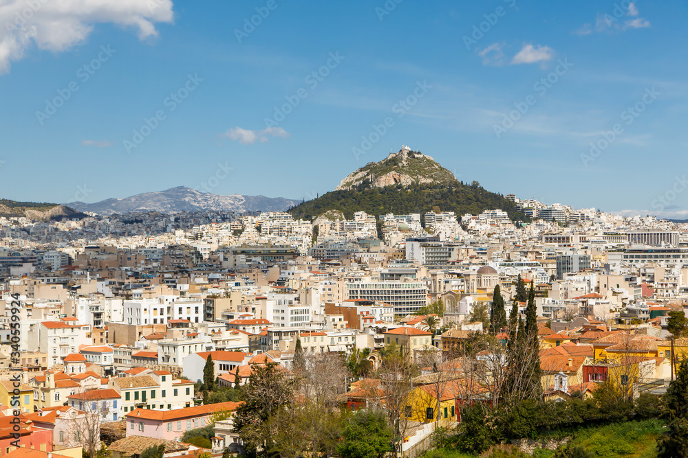 Cityscape of Athens and Lycabettus Hill in the background, Athens, Greece.