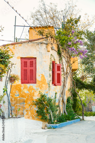 Fototapeta Naklejka Na Ścianę i Meble -  Architectural details from the narrow streets of Anafiotika, a traditional village in Athens, the Greek capital. Old neighborhood on the slopes of Acropolis, Greece