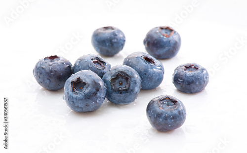 Group wet blueberries on white background. Isolated