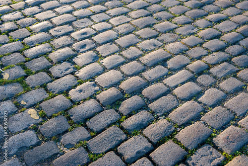 Cobblestones seen on Railway Street, Wigan, during an early morning on a sunny day