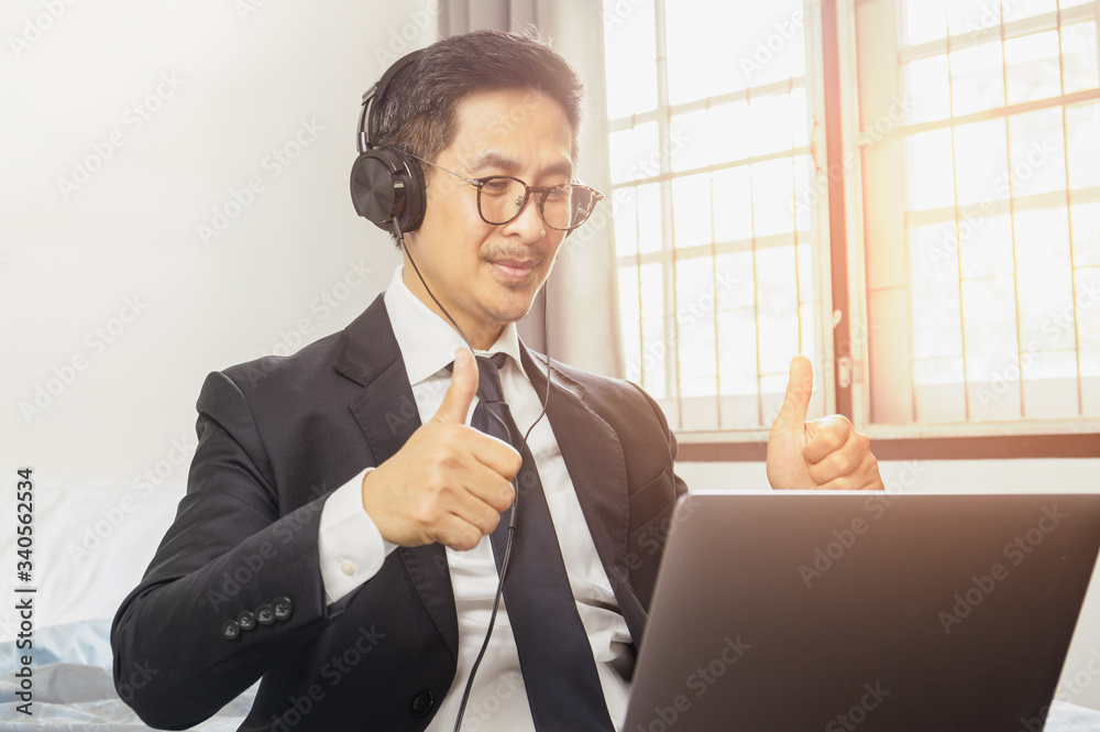 Businessman successful with thumps up while having video conference work from home concept. Businessman successful with thumps up while having video conference work from home concept.