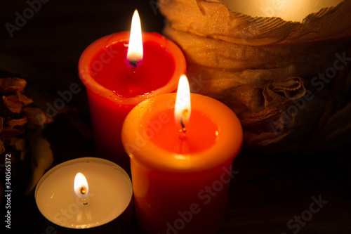 red candles in the dark