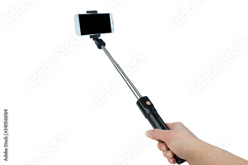 taking selfie - hand hold monopod with mobile phone.