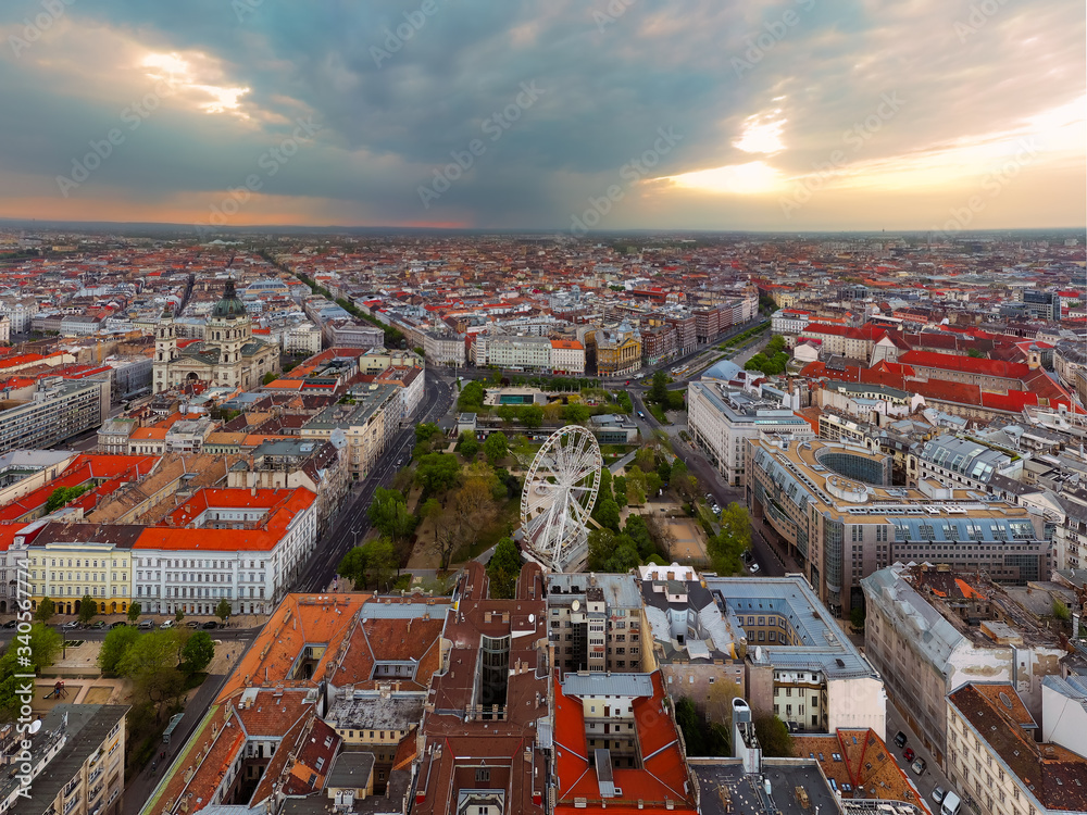Fototapeta premium Europe hungary Budapest. Aerial panoramic cityscape about Budapest with epic sky. A Storm is comming on the background. Famous historical downtown in the foreground with ferris wheel.