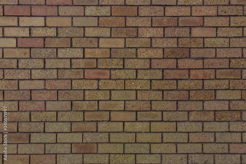 Naklejka premium Small bricks red and broen color arranged in rows on the wall