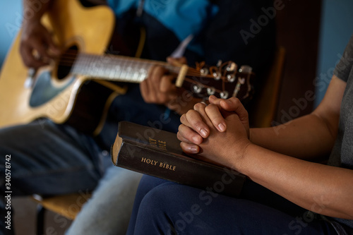 Christians are congregants join pray and seek the blessings of God photo