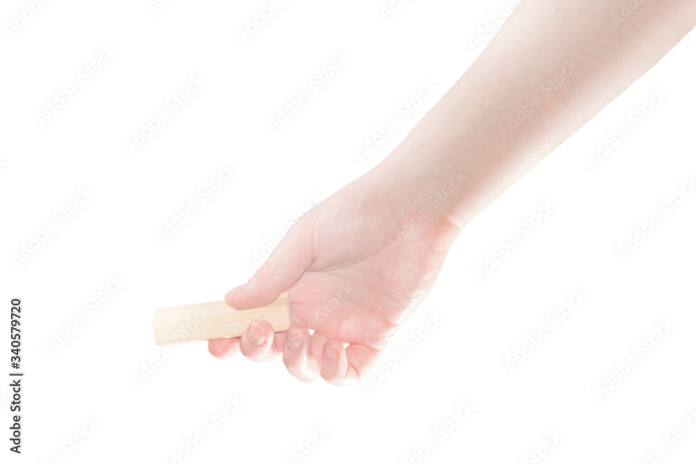 Female hand with a small rectangular bar in hand isolated on a white background. Template for product advertising in a box. Female hand with a small rectangular bar in hand isolated on a white background. Template for product advertising in a box.