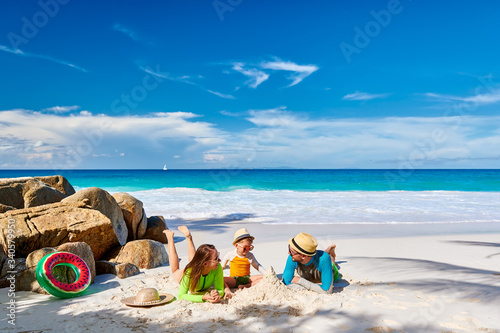 Family with three year old boy on beach
