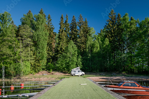 Camper van and boat at the pier