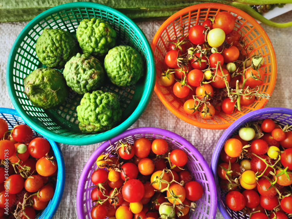 Sets of Red Berries and Fresh Green Kaffir Limes in Baskets for Sale Sets of Red Berries and Fresh Green Kaffir Limes in Baskets for Sale