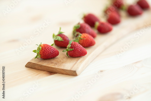 red fresh strawberries on wooden table