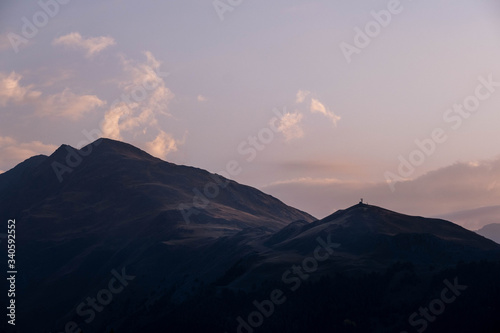 Mountains are lit by the setting sun in the Tusheti region.