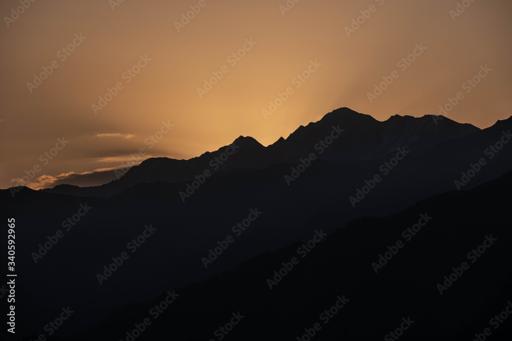 Mountains are lit by the setting sun in the Tusheti region. Mountains are lit by the setting sun in the Tusheti region.