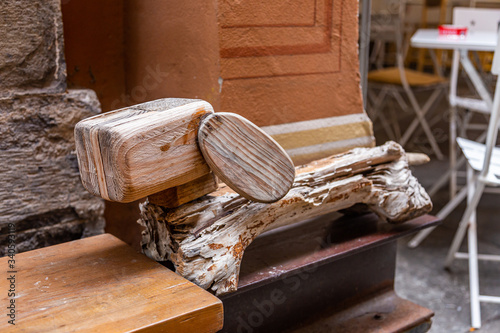 Wood art installation - Dachshund dog on a street in the city of Savona