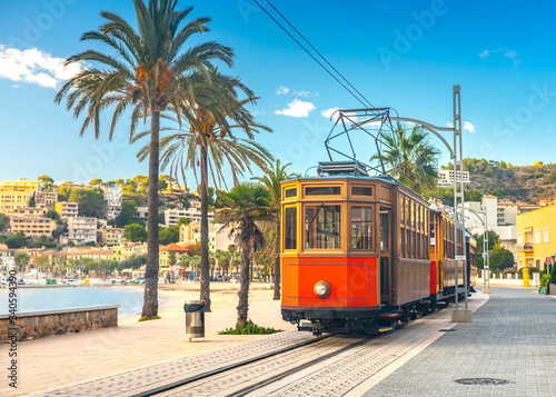 The famous orange tram runs from Soller to Port de Soller, Mallorca, Spain
 photo