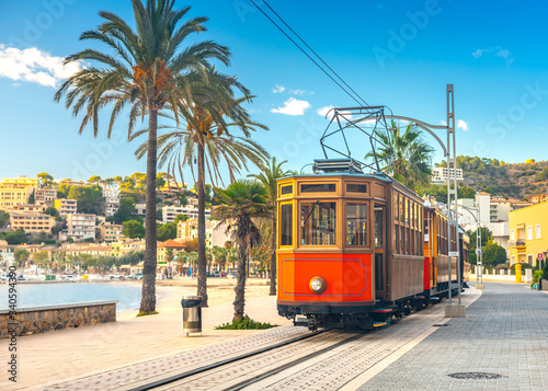Obraz na płótnie The famous orange tram runs from Soller to Port de Soller, Mallorca, Spain
w salonie