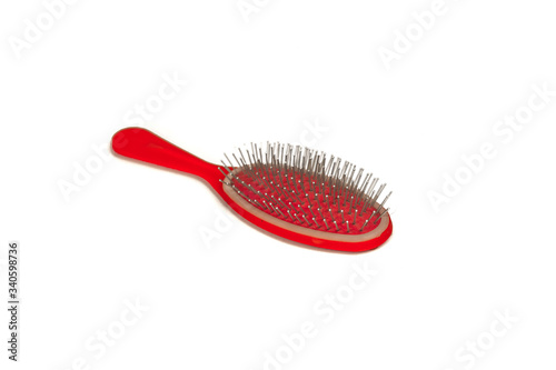 red hairbrush isolated on a white background