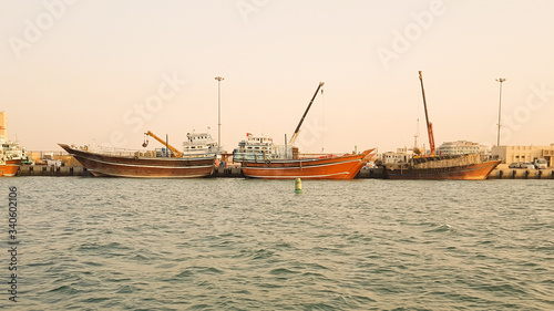 Boats on the harbor at sunset in Dubai