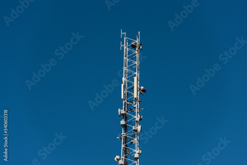 Communications pylon with cellular antennas and other communications equipment.